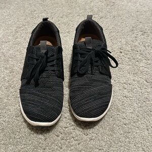 Black TOMS sneakers